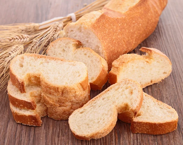 Bread on wood background — Stock Photo, Image