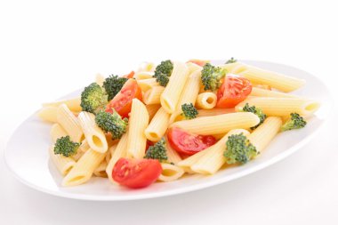 plate of pasta with tomato and broccoli
