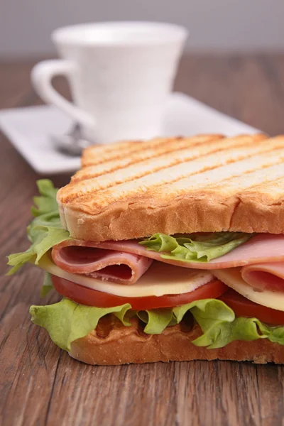 Sandwich on wood background — Stock Photo, Image