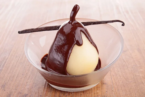 Pear with chocolate sauce — Stock Photo, Image