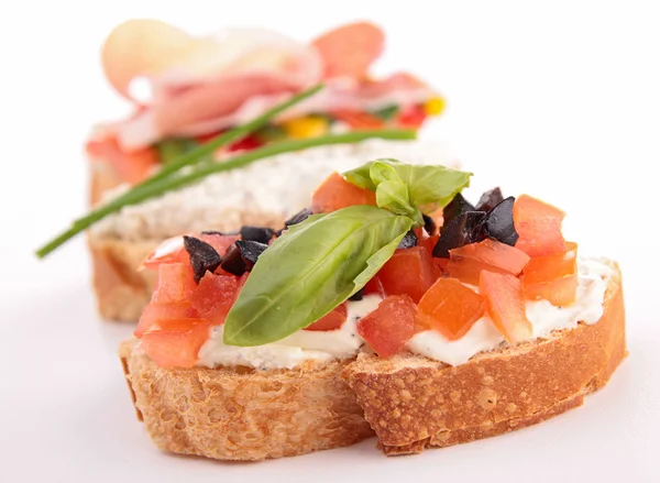 Bruschetta and vegetables — Stock Photo, Image