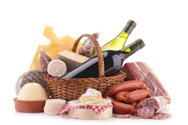 wicker basket with sausage, wine and cheese