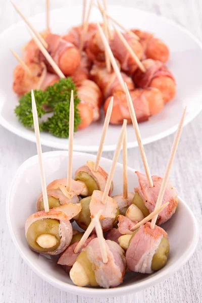 Wrapped bacon appetizer — Stock Photo, Image