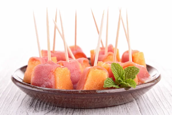 Appetizer, melon and prosciutto — Stock Photo, Image