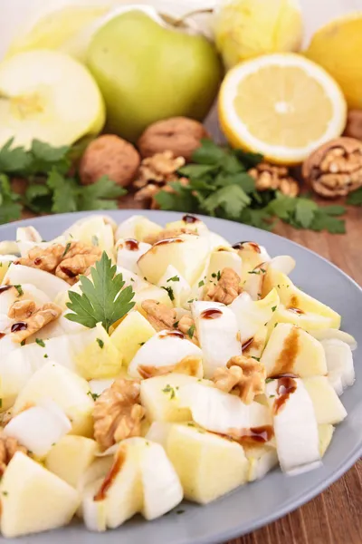 Chicory salad with walnut, apple and cheese — Stock Photo, Image