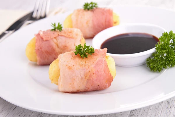 Potato rolled with bacon Stock Picture