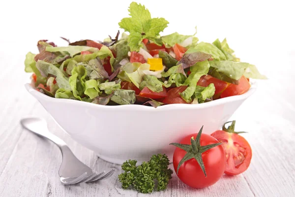 Bowl of salad and tomato — Stock Photo, Image