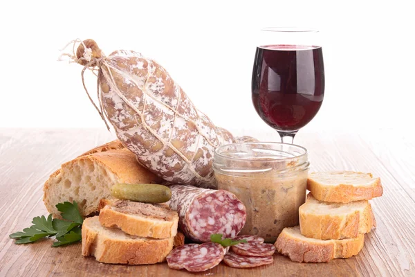 Wineglass with bread and sausage — Stock Photo, Image