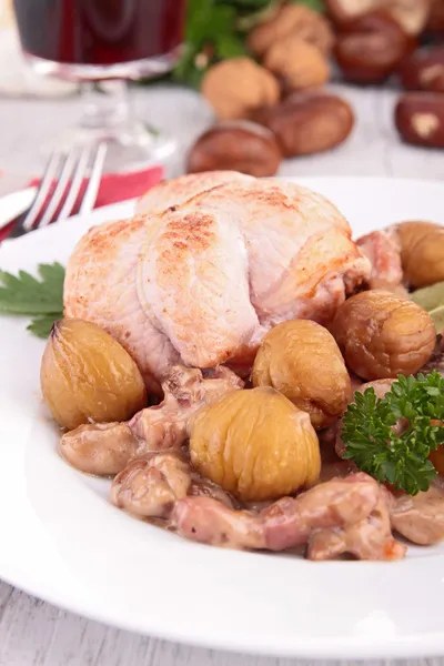 Cooked meat with chestnut and mushrooms — Stock Photo, Image