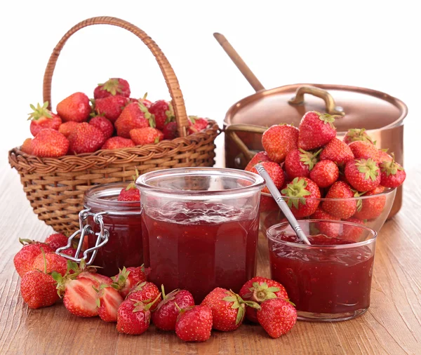 Strawberry jam, wicker basket and casserole — Stock Photo, Image