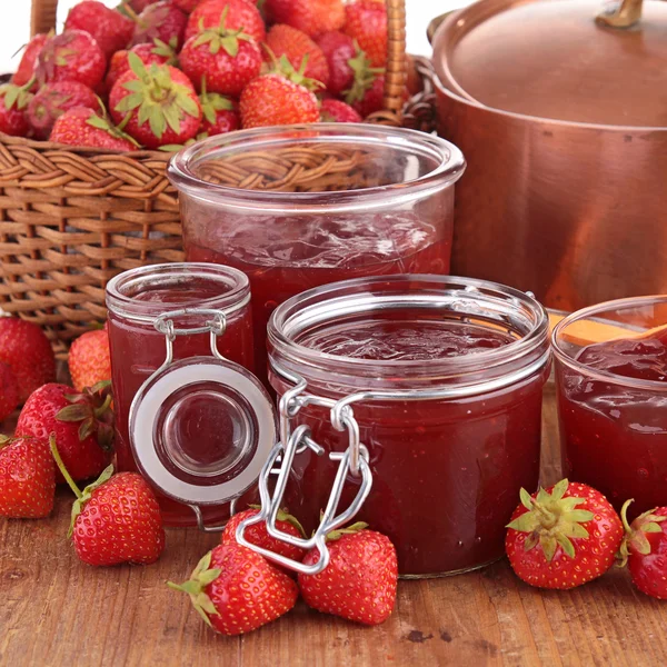 Strawberry jam, wicker basket and casserole — Stock Photo, Image