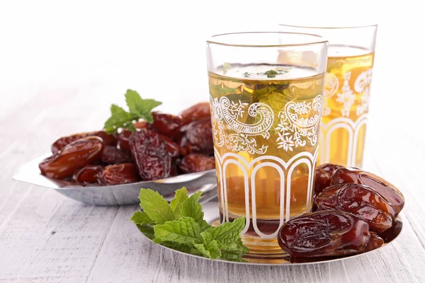 Teacup with sweet dried date — Stock Photo, Image