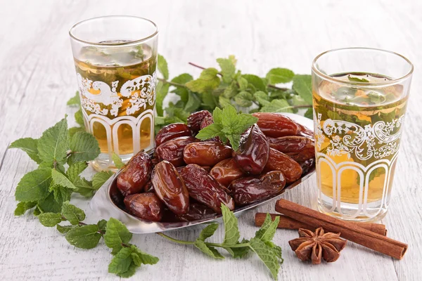 Teacup with sweet dried date — Stock Photo, Image