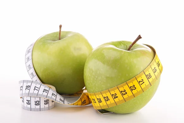 Green apple and tape — Stock Photo, Image