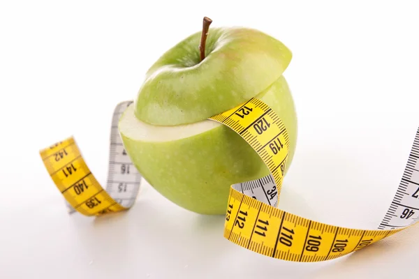 Green apple and tape — Stock Photo, Image