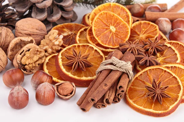 Dried orange sliced with cinnamon and nuts — Stock Photo, Image