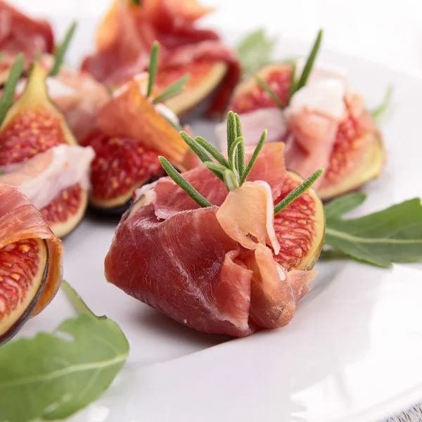 Appetizer, fig and prosciutto ham — Stock Photo, Image