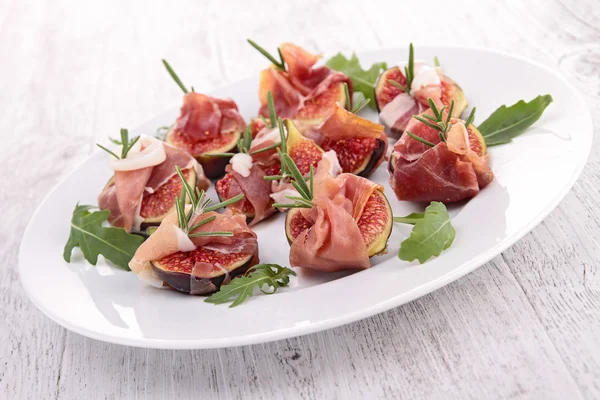 Appetizer, fig and prosciutto ham — Stock Photo, Image