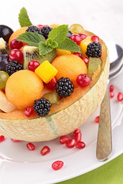 Fruit salad in melon bowl — Stock Photo, Image