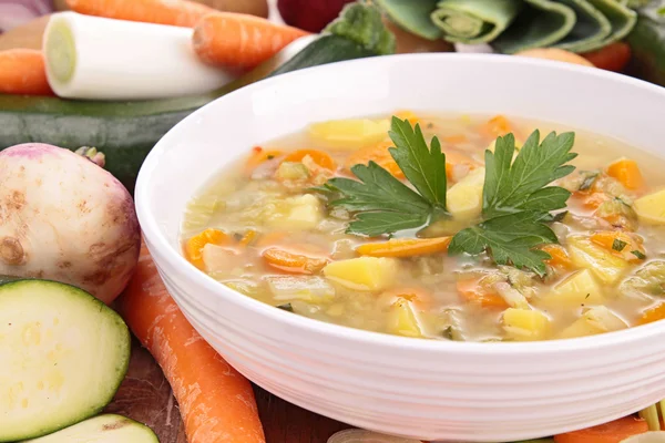 Bowl of soup and vegetables — Stock Photo, Image