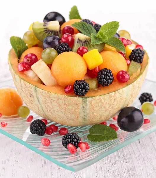 Fruit salad in melon bowl — Stock Photo, Image