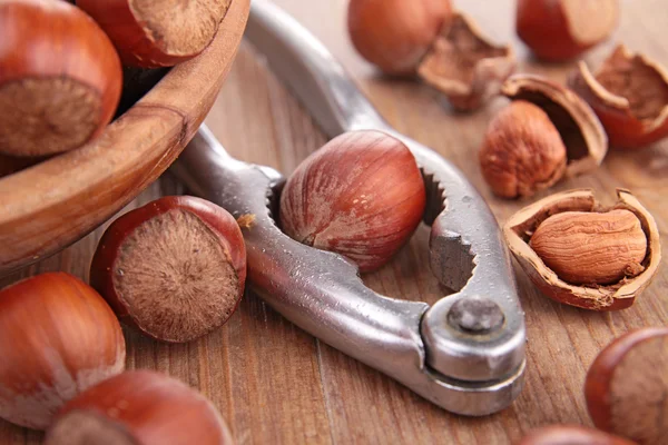 Hazelnuts and nutcracker — Stock Photo, Image