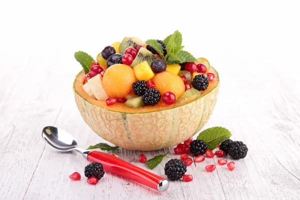 Fruit salad in melon bowl — Stock Photo, Image