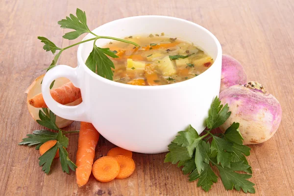 Bowl of soup and vegetables — Stock Photo, Image