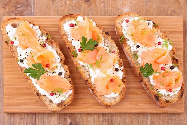 Bruschetta, bread and salmon — Stock Photo, Image