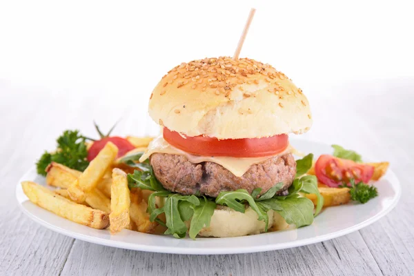 Sabrosa hamburguesa en el plato — Foto de Stock