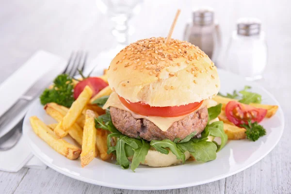 Tasty burger on plate — Stock Photo, Image