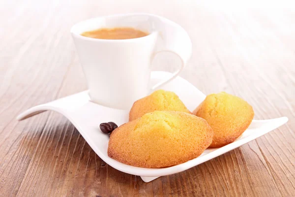 Coffee cup and madeleine — Stock Photo, Image