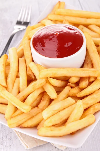 Pommes und Ketchup lizenzfreie Stockfotos