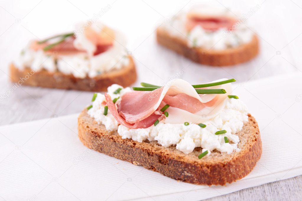 Canape with cheese and prosciutto
