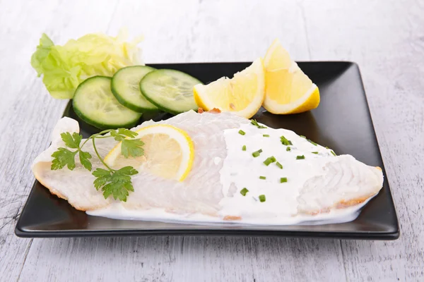 Fish fillet and cream — Stock Photo, Image