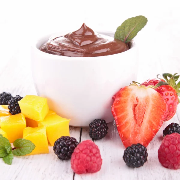 Chocolate sauce and fruits — Stock Photo, Image