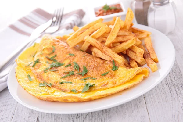 Omelet and french fries — Stock Photo, Image