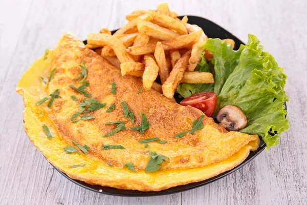 Omelet and french fries — Stock Photo, Image