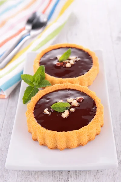 Chocolate tarts and cherries — Stock Photo, Image