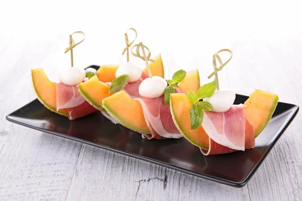 Melon, prosciutto and mozzarella — Stock Photo, Image