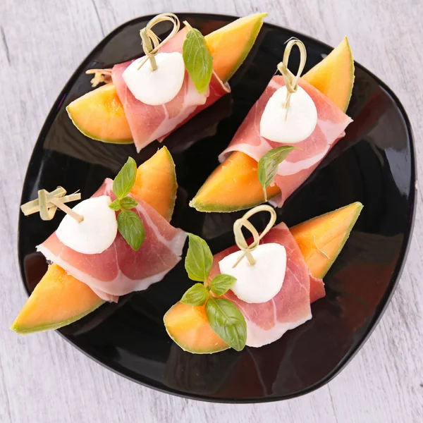 Meloen, ham en mozzarella — Stockfoto