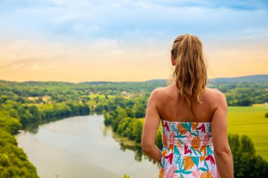 Woman looking at panorama view of dordogne river- Correze in France