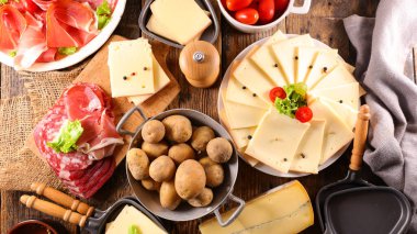 raclette cheese, potatoes and prosciutto ham