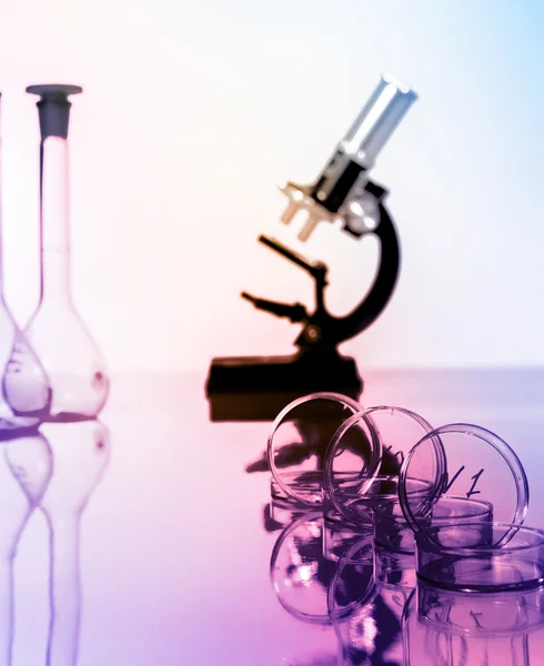 Microscope and test tubes used in laboratory — Stock Photo, Image