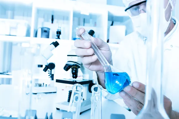 Scientist working in the lab a with liquid — Stock Photo, Image