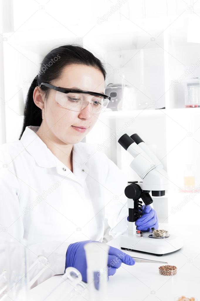 Woman laboratory assistant in the laboratory of food quality
