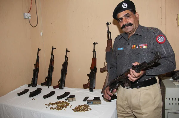 Weapon that seized by police after an intelligence based targeted raid in Drigh Road, kept to show media persons during a press conference Stock Picture