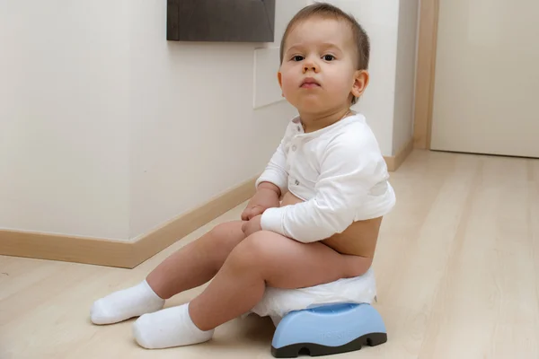 Boy sitting on a traveling potty — Stock Photo, Image