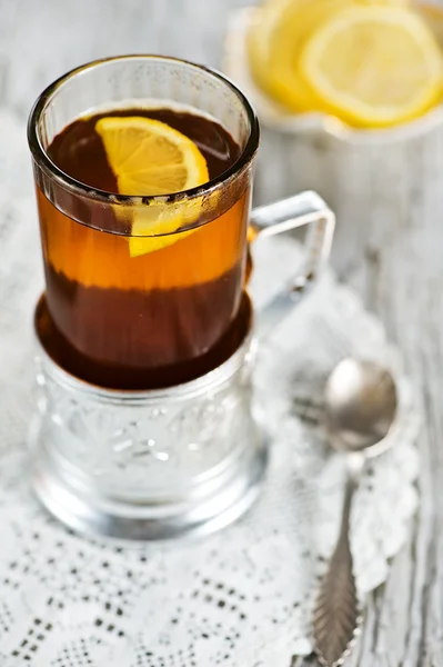 Tea and lemon in the glass with holder — Stok fotoğraf