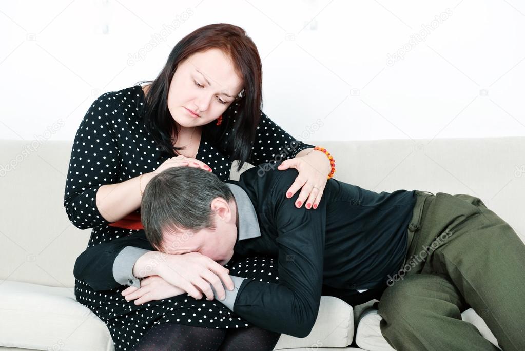 Woman comforting her crying man
